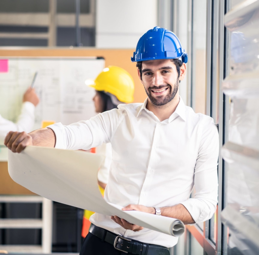 smile-engineer-caucasian-man-hold-blueprint-drawing-while-team-members-give-some-advice-brainstorm-idea-structure-control-min